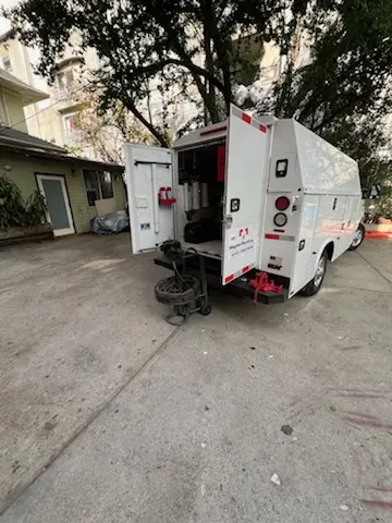 Magnet Plumbing service vehicle on-site for Water Heater Repair in Larchmont Village Apartments West